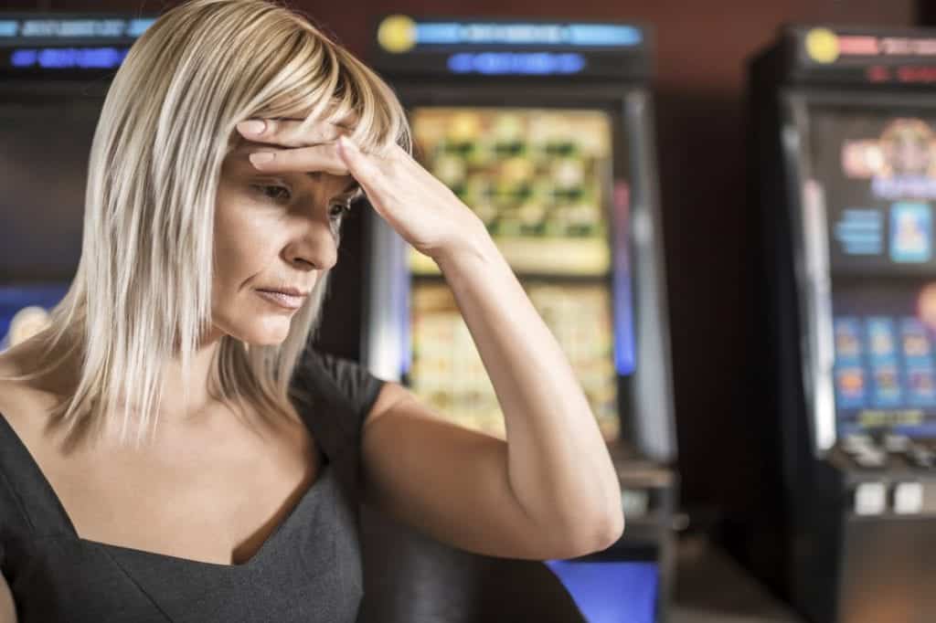 Woman At A Casino With A Worried Look On Her Face Stock Photo