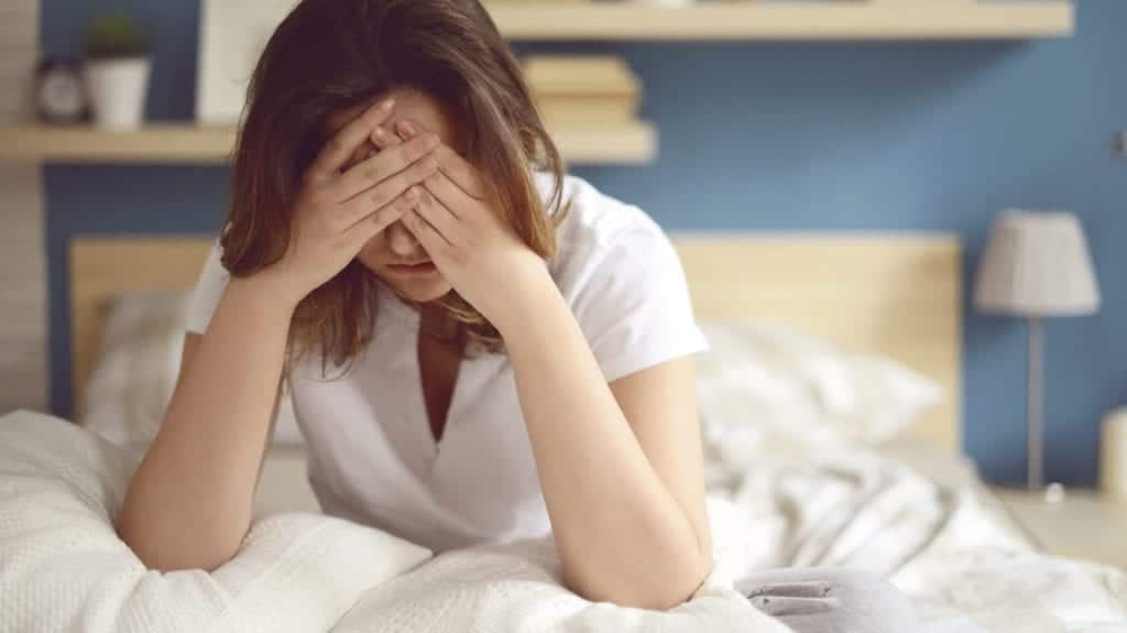 Woman Covering Her Eyes In Distress Stock Photo