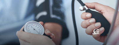 Nurse Taking Male Patient's Blood Pressure Stock Photo