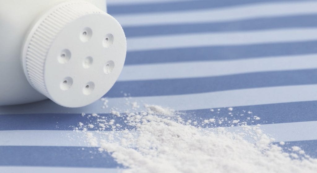 Spilled Talcum Powder Bottle Stock Photo