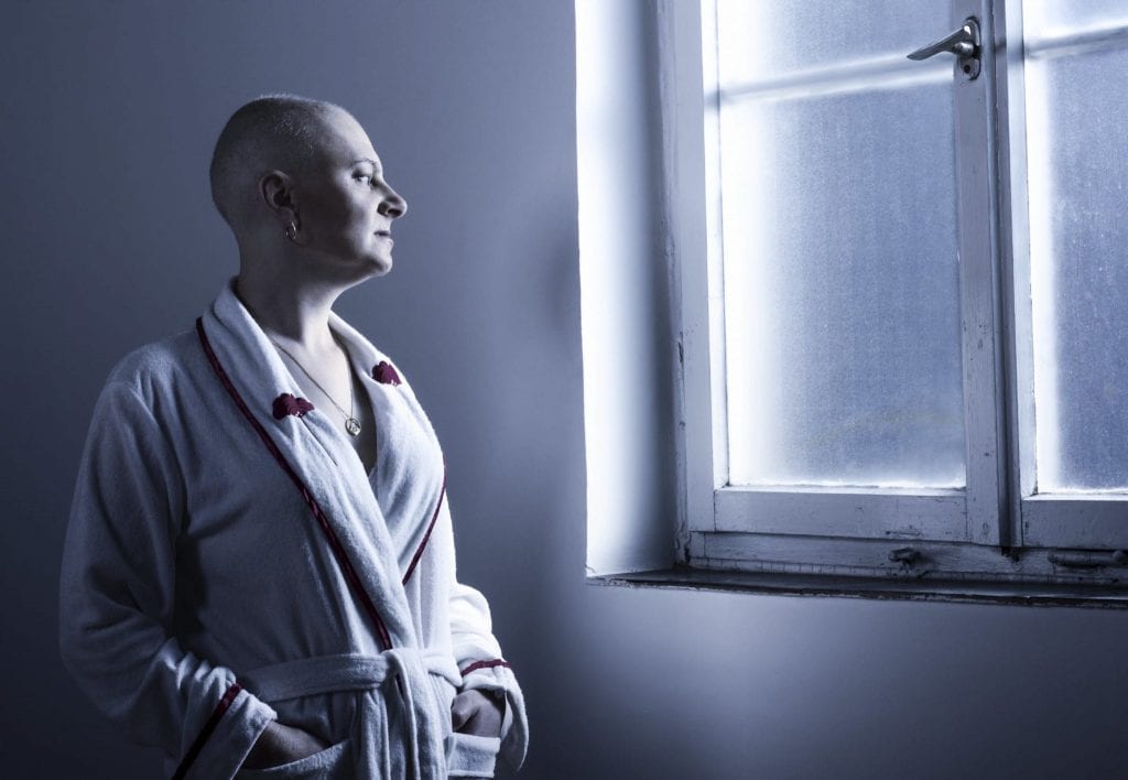 Bald Woman In A Robe Stock Photo