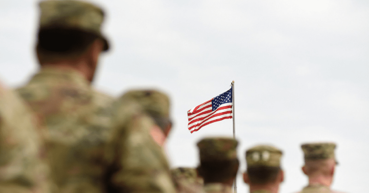 American Soldiers Saluting The Flag Stock Photo