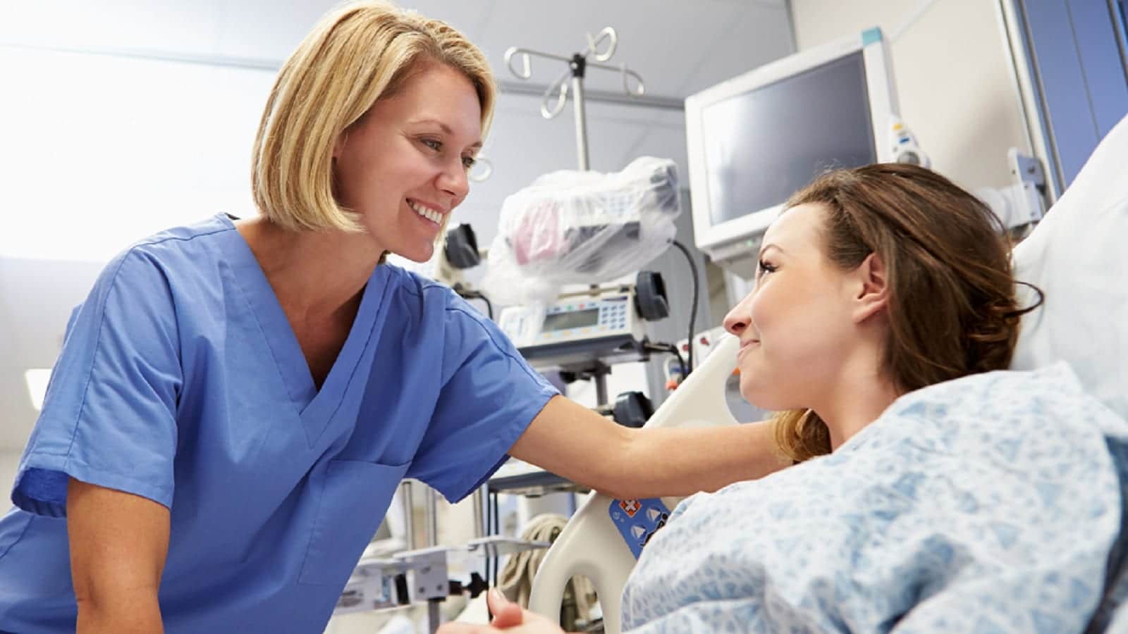 Young Female Nurse Meeting With Female Patient